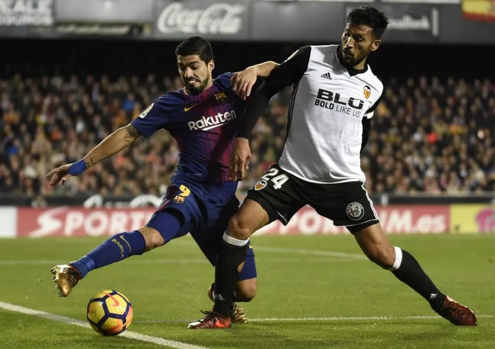 Luis Suárez y Ezequiel Garay
