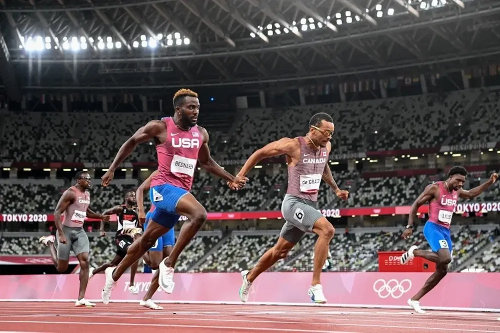 La definición de De Grasse junto a Kenneth Bednarek y Noah Lyles