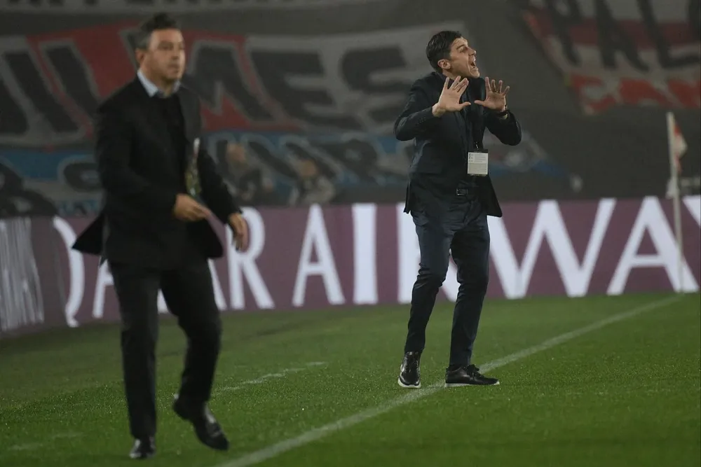 Marcelo Gallardo y Alexander Medina