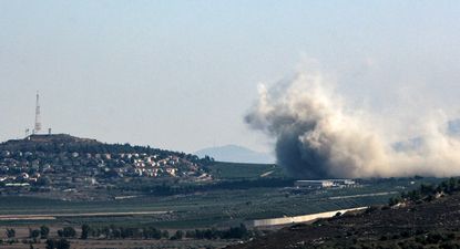 Smoke billows from the site of an Israeli strike that targeted the outskirts of the southern Lebanese village of Kfar Kila, facing the Israel village of Metullah (L) on August 7, 2024. The cross-border violence since October 2023 has killed some 556 people in Lebanon, mostly fighters but also including at least 116 civilians, according to an AFP tally.