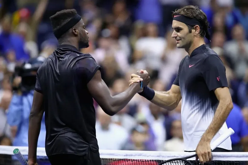 Frances Tiafoe y Roger Federer