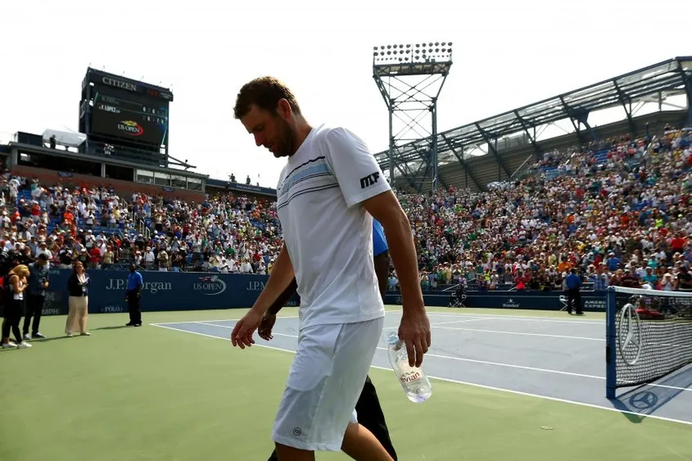 NEW YORK, NY - SEPTEMBER 02: Mardy Fish of the United States walks off of the court after losing his Mens Singles Second Round match against Feliciano Lopez of Spain on Day Three of the 2015 US Open at the USTA Billie Jean King National Tennis Center on September 2, 2015 in the Flushing neighborhood of the Queens borough of New York City.   Clive Brunskill/Getty Images/AFP== FOR NEWSPAPERS, INTERNET, TELCOS & TELEVISION USE ONLY ==