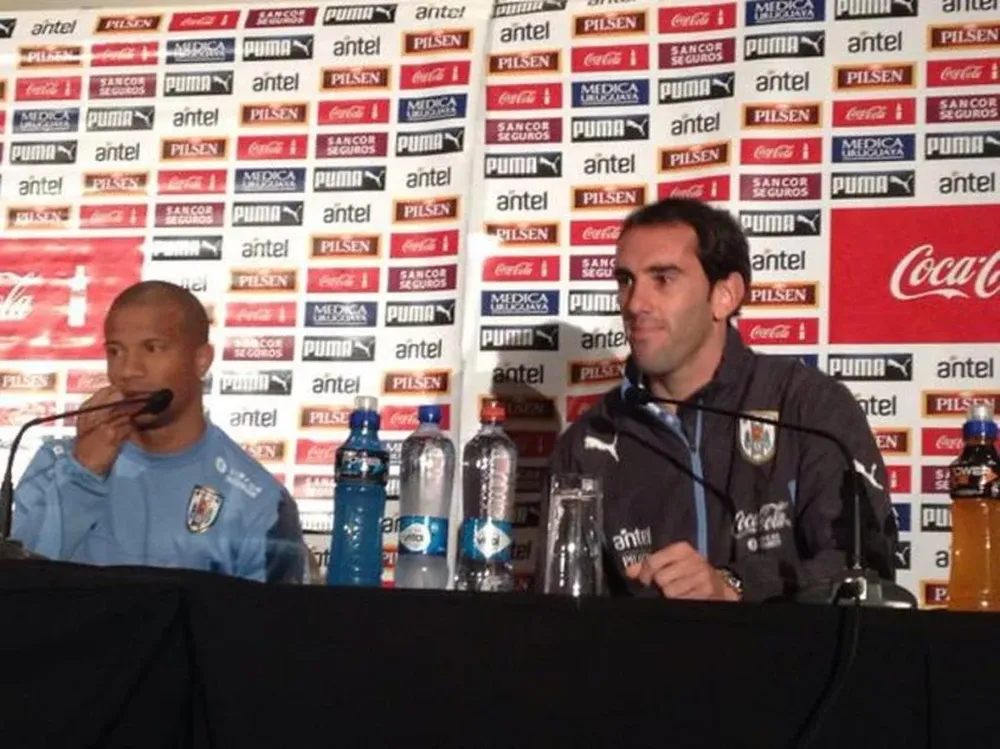 Diego Godín y Carlos Sánchez