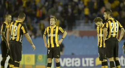 Hernán Novick y una imagen del pesar de la derrota