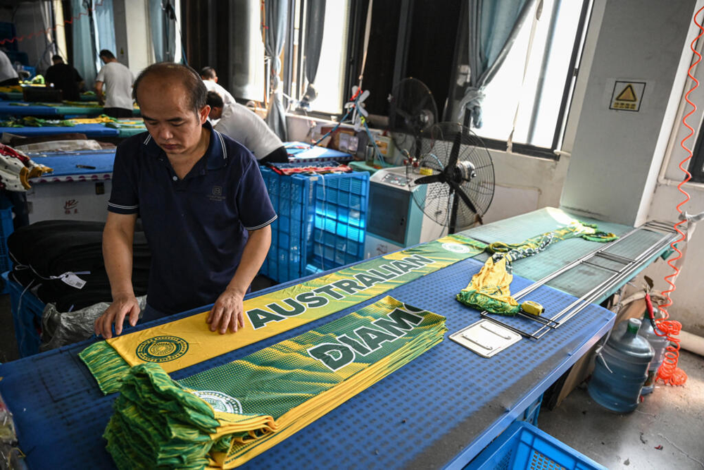 Fabricante con bufandas de la selección de Australia.