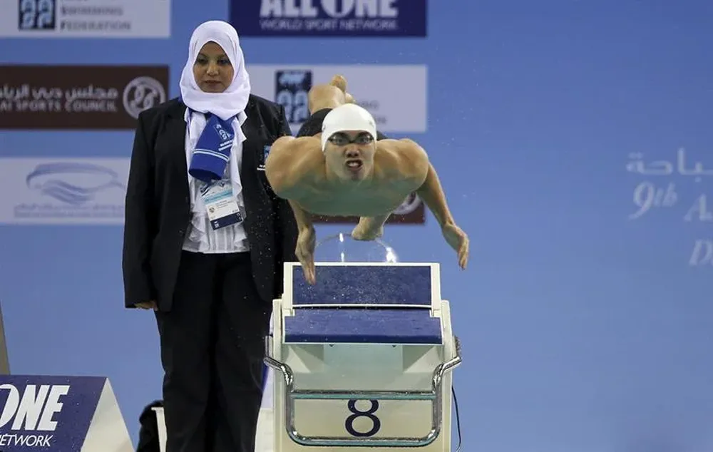 Emiratos Árabes- El taiwanés Chi Chieh compite en la 100 metros mariposa en el Campeonato Asiático