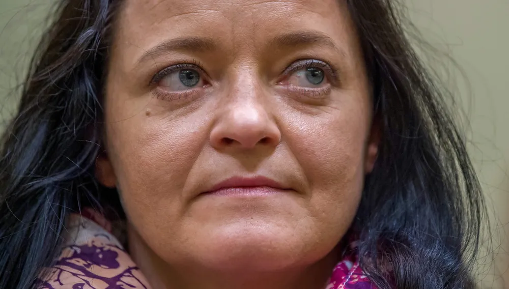 Defendant Beate Zschaepe waits in a courtroom before the proclamation of sentence in her trial as the only surviving member of neo-Nazi cell National Socialist Underground (NSU) behind a string of racist murders, in Munich, Germany, on July 11, 2018. Zschaepe, 43, is accused of complicity in 10 deadly shootings of mostly Turkish and Greek-born immigrants carried out by clandestine trio the National Socialist Underground (NSU). / AFP / POOL / MICHAELA REHLE