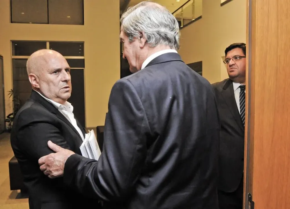 Stirling junto con Edgardo Novick, mientras fue su asesor en seguridad.