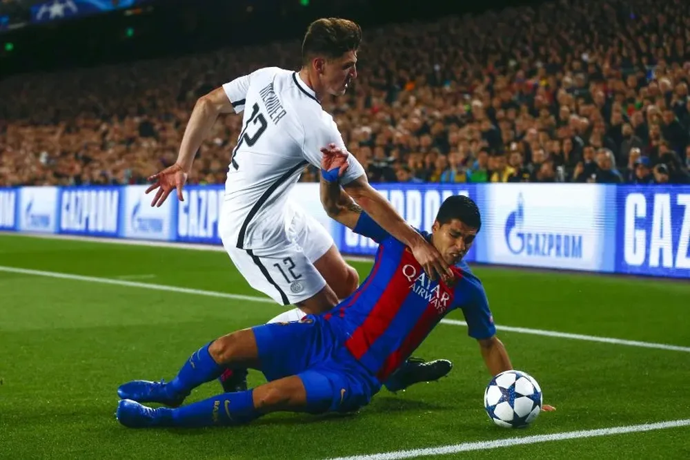Thomas Meunier y Luis Suárez