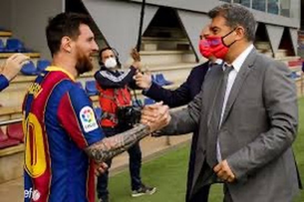Lionel Messi y Joan Laporta.&nbsp;