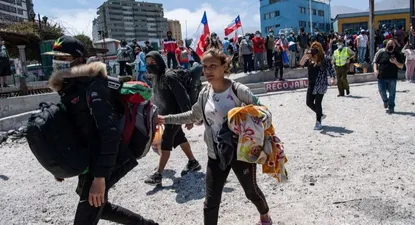 Decenas de venezolanos tuvieron que escapar de la marcha antimigrante realizada el 26 de septiembre en la ciudad de Iquique (Chile).