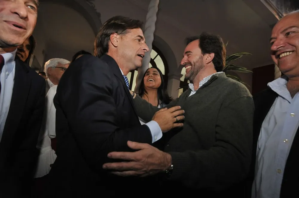 El presidente Lacalle Pou y el ministro de Turismo, Germán Cardoso