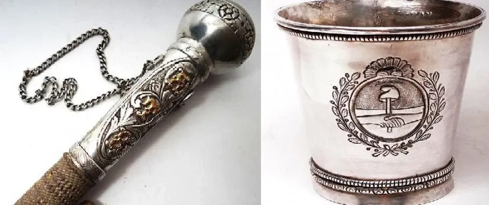 Vaso de plata colonial labrado y un fino rebenque con cabo de plata y oro cincelado