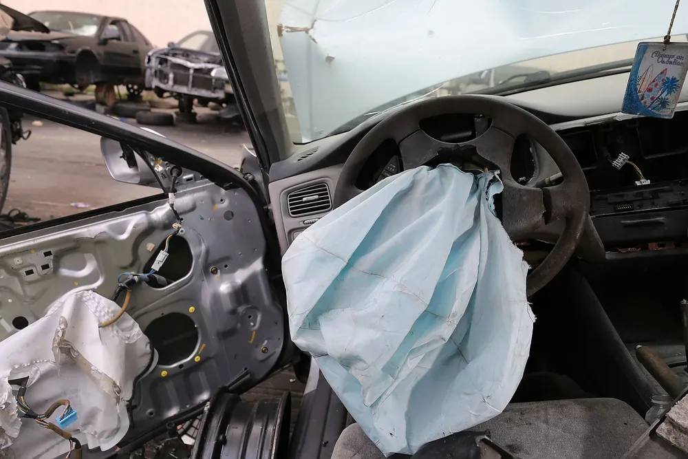 (FILES) This file photo taken on May 21, 2015 shows a deployed airbag is seen in a 2001 Honda Accord at the LKQ Pick Your Part salvage yard in Medley, Florida.  Japan
