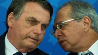 Jair Bolsonaro conversa con Paulo Guedes