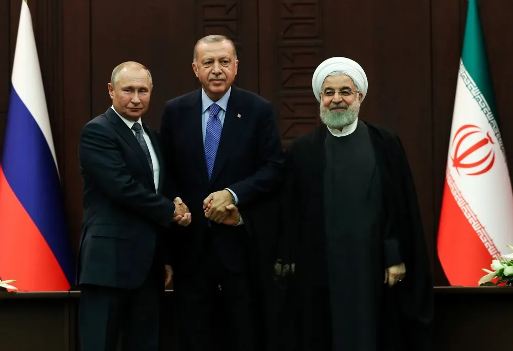 Putin (izquierda), Erdogan (centro) y el expresidente de Irán, Hassan Rouhani, en una reunión de 2019