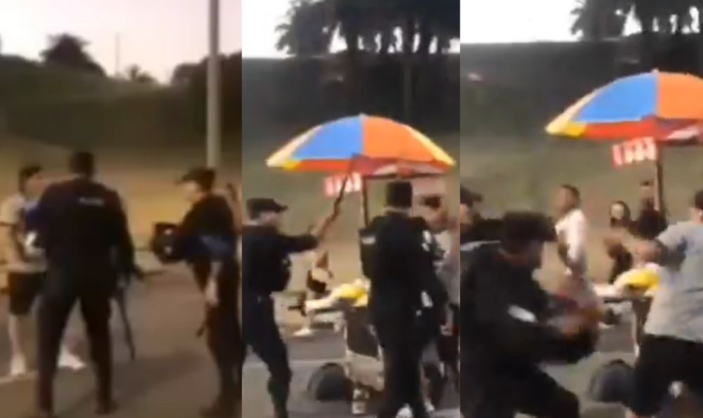 Pelea entre policías y comerciante ambulante