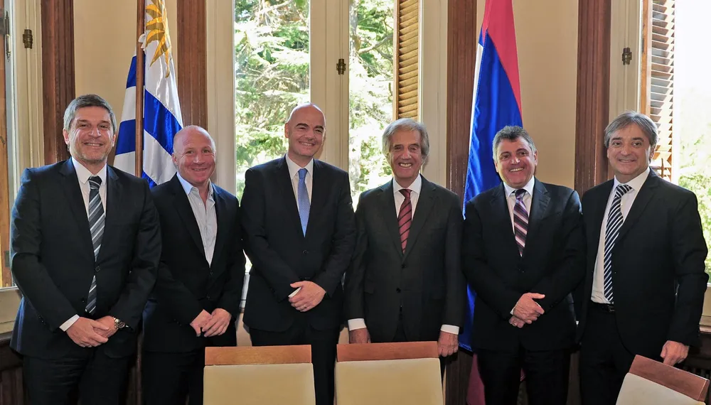 Handout photo released by the Uruguayan Presidency of (L-R) Uruguayan Football Association (AUF) manager Alejandro Balbi, Argentinas Sports Secretary Carlos Mac Allister, FIFA president Swiss Gianni Infantino, Uruguayan President Tabare Vazquez, AUF president Wilmer Valdez and Uruguayan Sports Secretary Fernando Caceres posing during a meeting at the presidential residence in Montevideo on March 30, 2016. Vazquez expressed formally the interest of Uruguay and Argentina of co-organizing the FIFA World Cup 2030. Infantino is on a South American tour that will also take him to Bolivia and Colombia. AFP PHOTO / URUGUAYAN PRESIDENCY