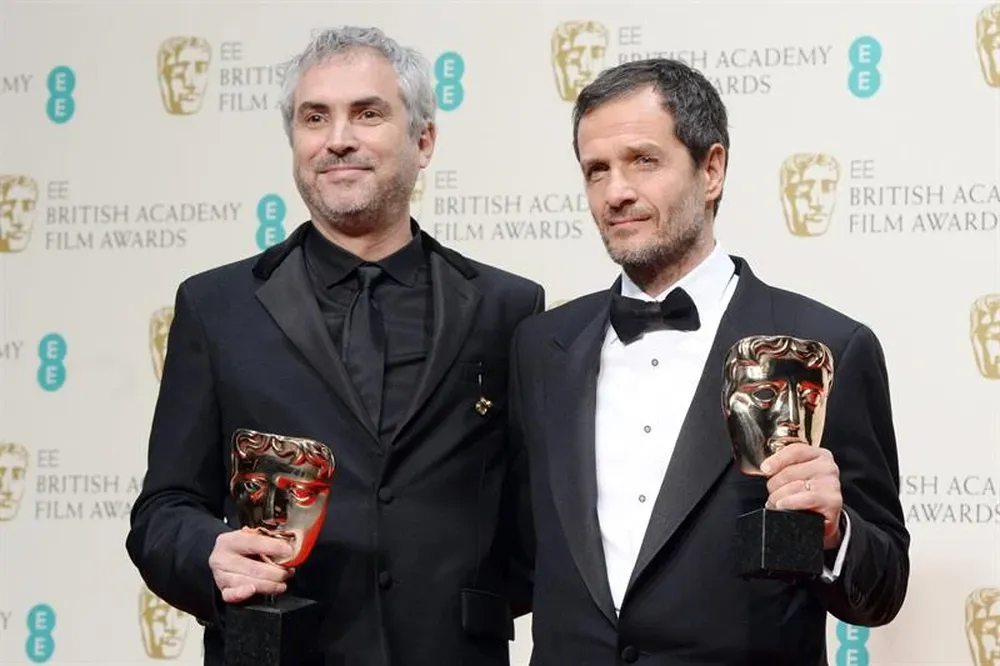Alfonso Cuarón junto al productor David Heyman