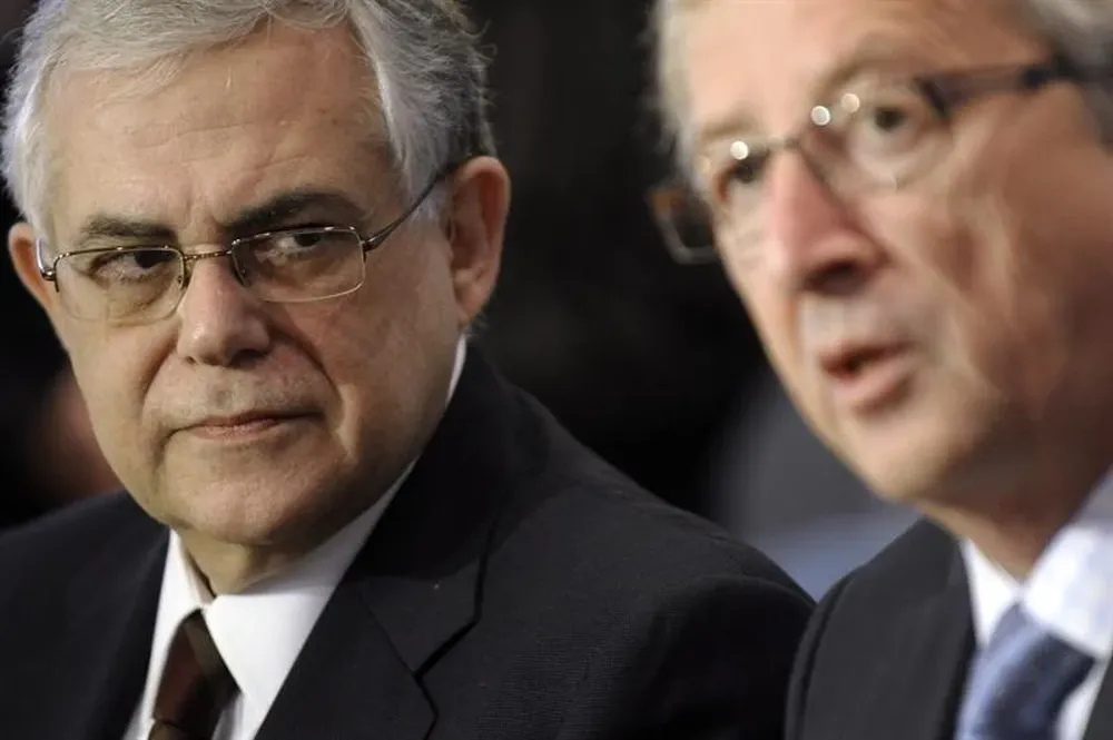 Lukás Papadomus y el presidente del Eurogrupo