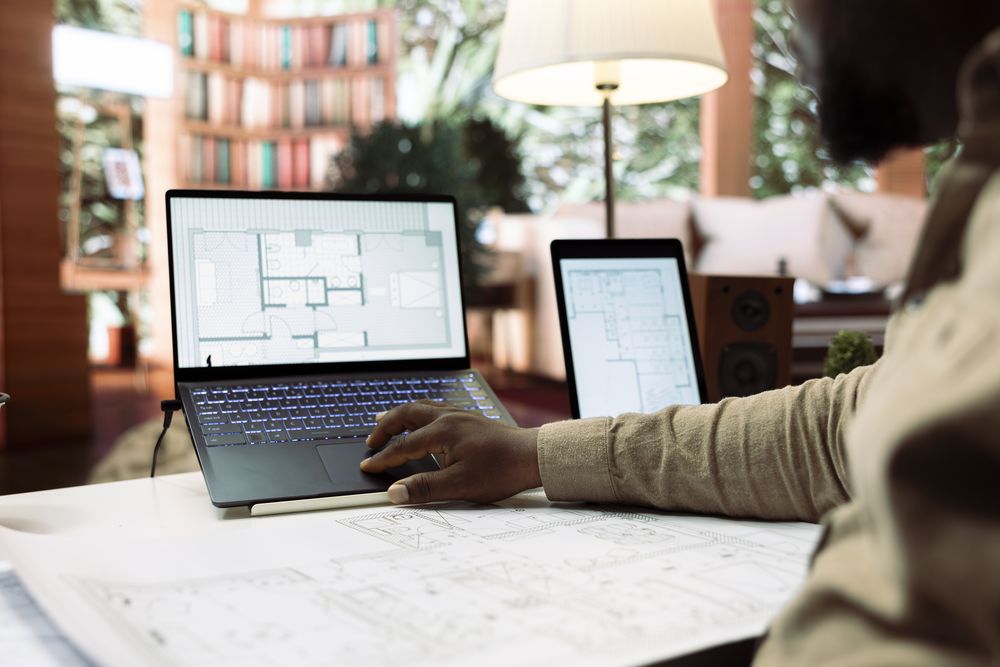 businessman-using-digital-tools-draft-plan-office-spaces-relocate (1).jpg