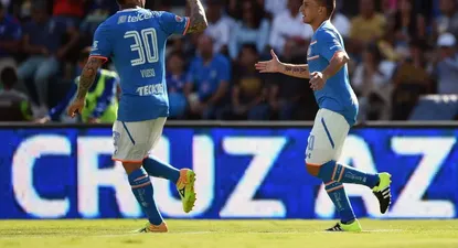 Christian Gimenez (R) of Cruz Azul celebrates his goal against Pumas with his teammate (R) Matias Vuoso (L) during their Mexican Apertura tournament at the Estadio Azul in Mexico City on September 19, 2015. AFP PHOTO/ ALFREDO ESTRELLA