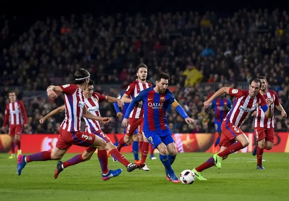 Lionel Messi y Diego Godín