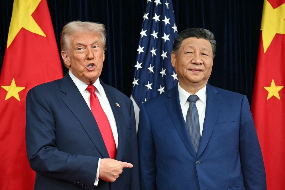 Donald Trump junto a Xi Jinping. AFP