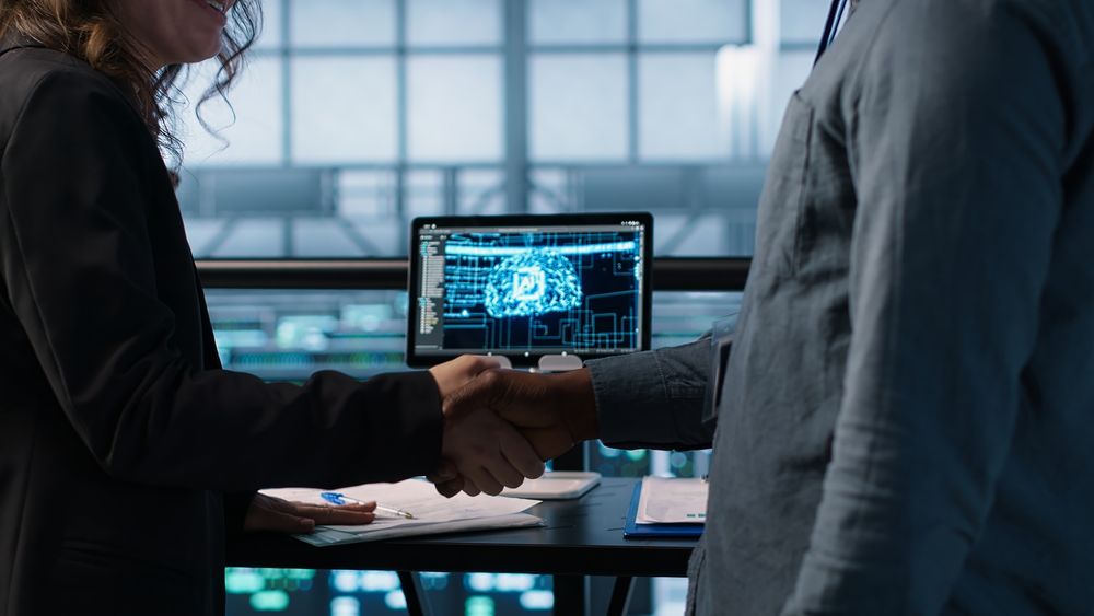 people-doing-handshake-ai-based-server-farm-checking-files-doing-deal (1)