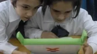 Niños con computadoras del Plan Ceibal