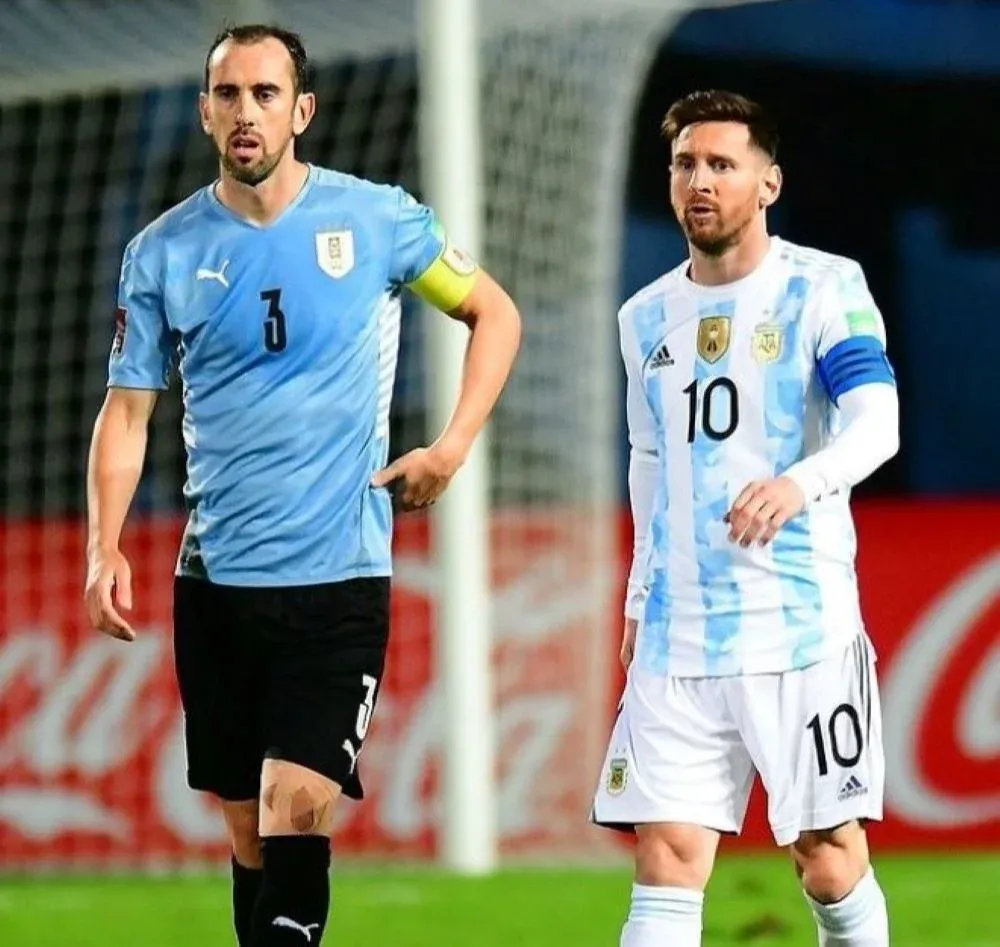 Diego Godín y Messi