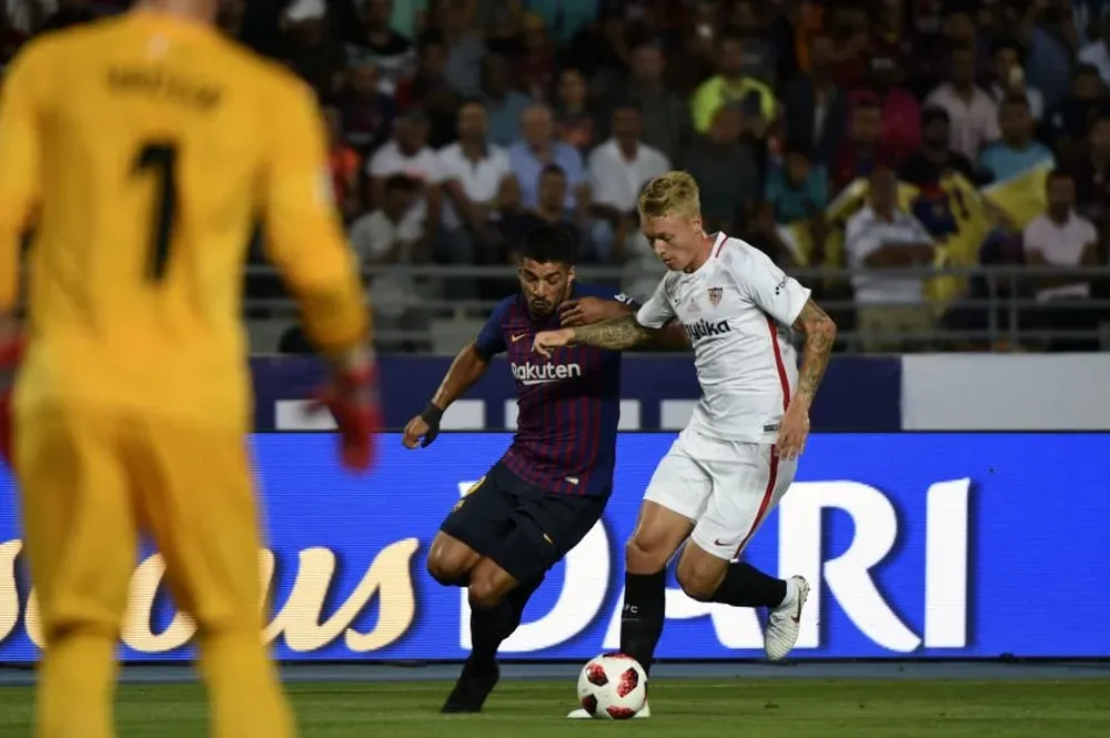 Luis Suárez y Simon Kjaer