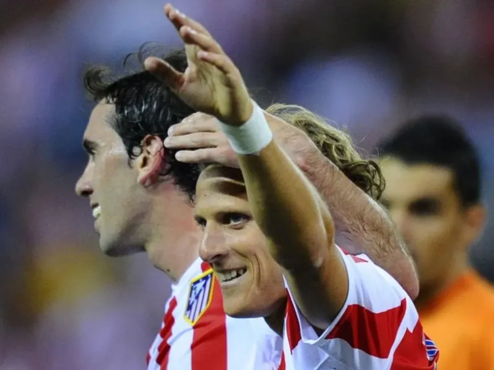 Godín y Forlán regresaron a los trabajos con Atlético de Madrid