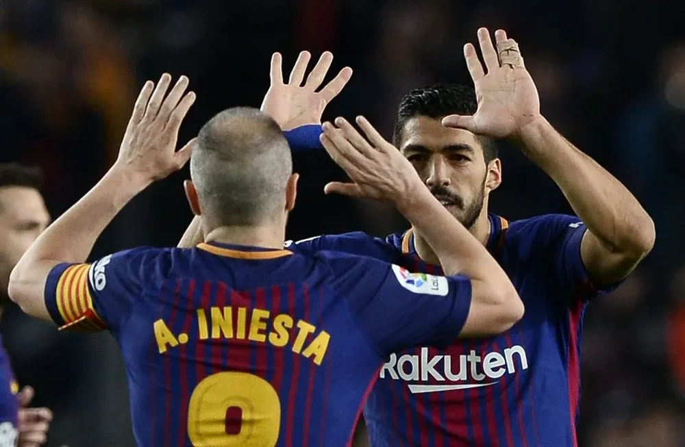 Andrés Iniesta y Luis Suárez