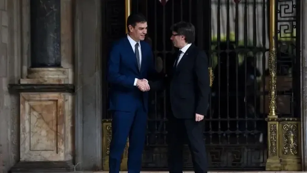 Pedro Sánchez y Carles Puigdemont.