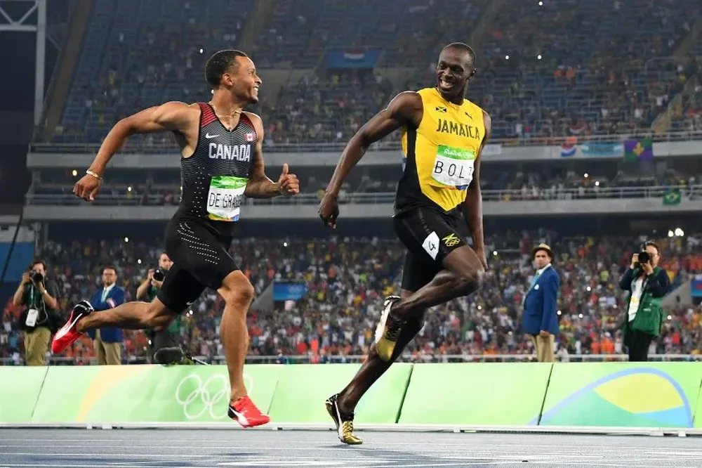 Andre De Grasse y Usain Bolt
