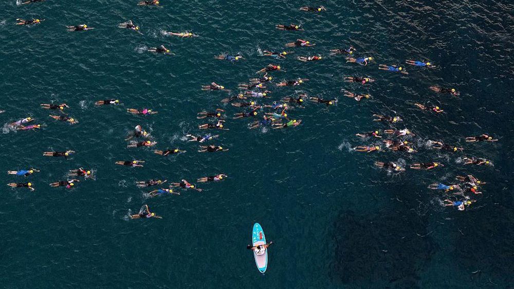 La competencia incluía un tramo de 3,8 kilómetros de natación en el mar.