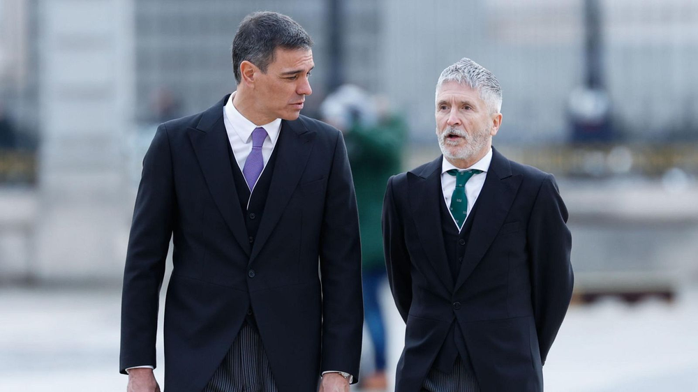 Pedro Sánchez, presidente del Gobierno español y el ministro del Interior, Fernando Grande-Marlaska.