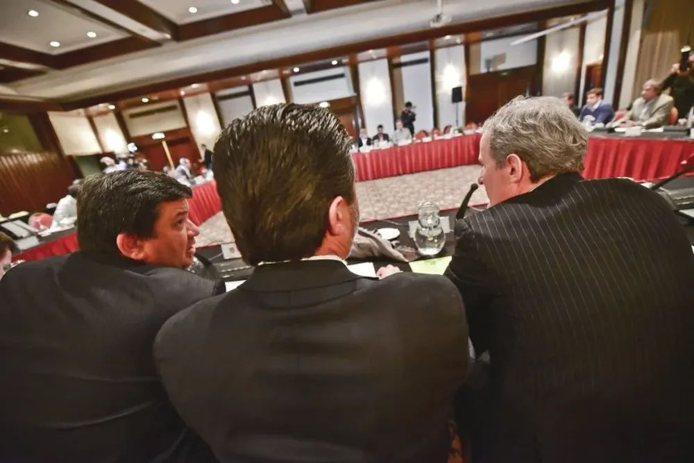 Jorge Barrera, Daniel Angelici y Juan Pedro Damiani, tres cabezas de la nueva organización clubista.