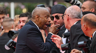 Encontronazo entre Denzel Washington y un fotógrafo en la alfombra roja de Cannes