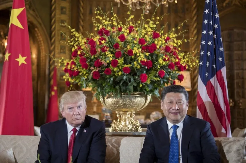 El presidente Donald Trump, junto a su par chino, Xi Jinping