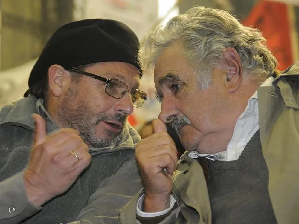 Olesker y Mujica en plena charla