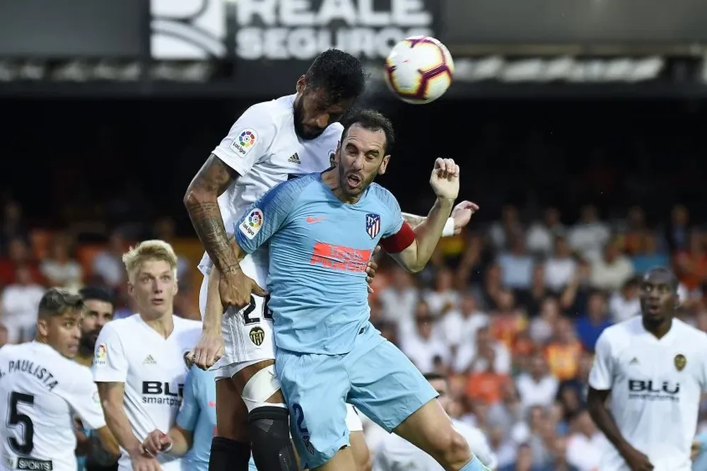 Ezequiel Garay y Diego Godín