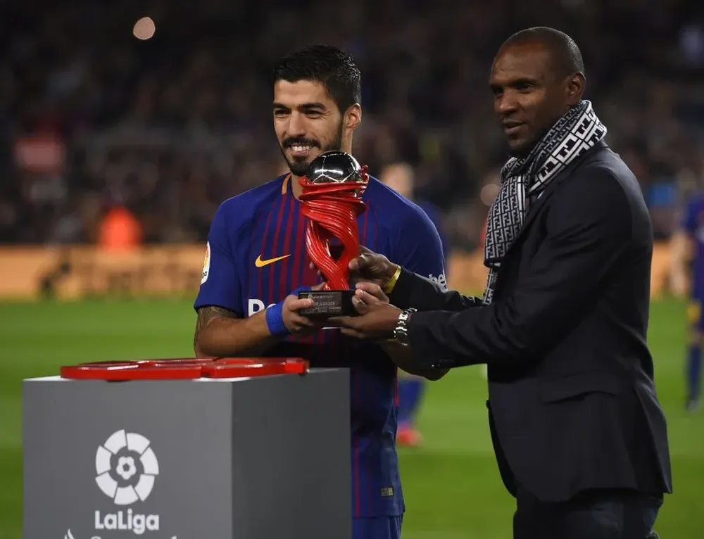 Eric Abidal y Luis Suárez