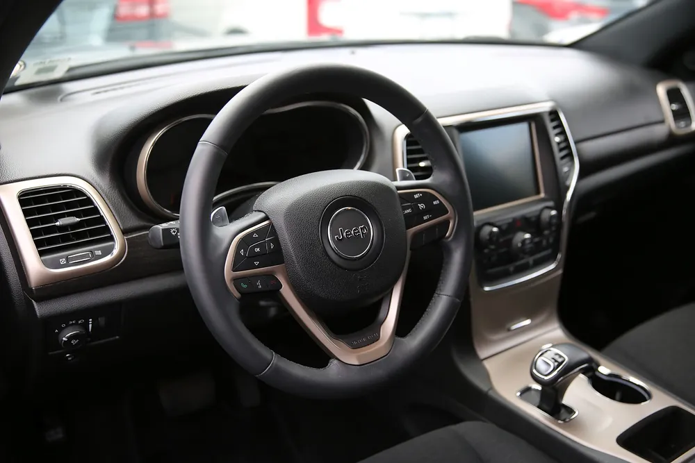 MIAMI, FL - JULY 24: The interior of a Fiat Chrysler Jeep Grand Cherokee is seen on a sales lot as the company announced it is recalling about 1.4 million Dodges, Jeeps, Rams and Chryslers vehicles equipped with certain radios on July 24, 2015 in Miami, Florida. The recall was announced after hackers were able to manipulate remotely a Jeep Cherokees computer software.   Joe Raedle/Getty Images/AFP== FOR NEWSPAPERS, INTERNET, TELCOS & TELEVISION USE ONLY ==