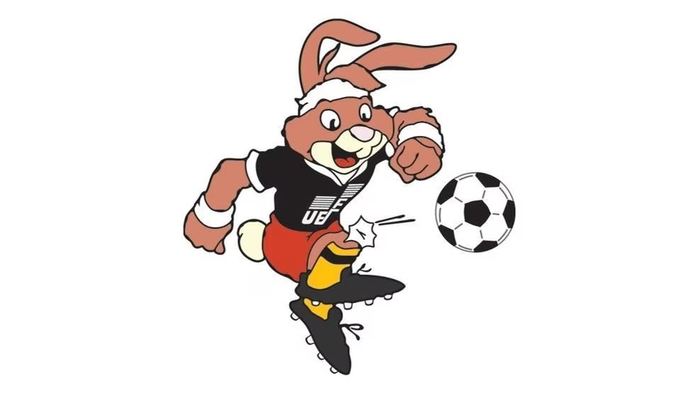 Berni (Alemania Federal 1988): Berni, el conejo alemán, posa con orgullo en su uniforme deportivo, representando la pasión y el espíritu competitivo de Alemania.