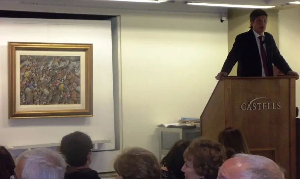 Juan Castells en el instante en que escuchaba ofertas por la obra de José Gurvich